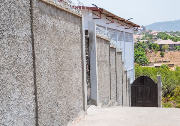 Walled walkway along the side of the warehouse