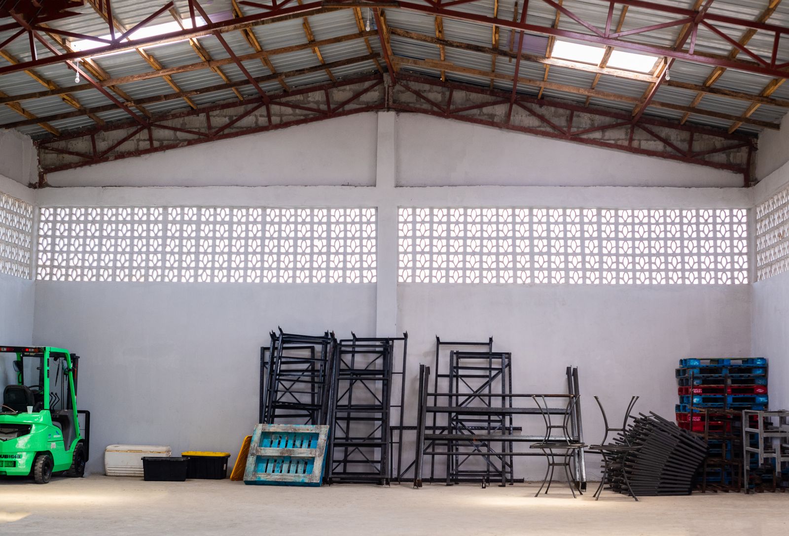 Inside the warehouse: forklift, shelving and pallets