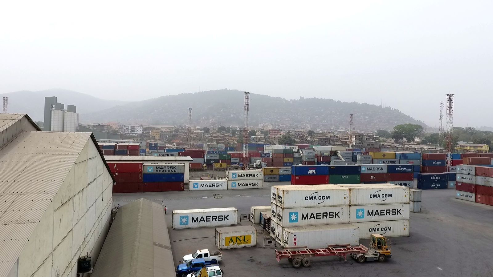 Containers staged beside the port warehouse